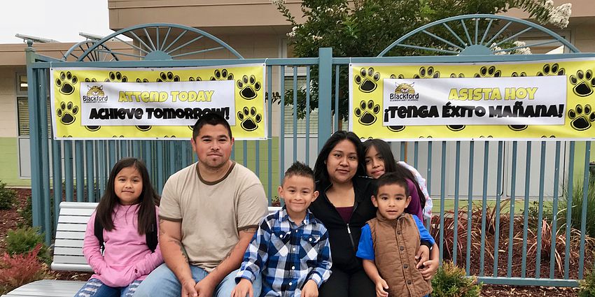 family waits for the morning school bell