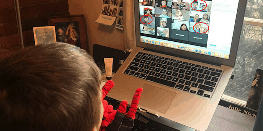 boy looking at screen with several faces and some obscured