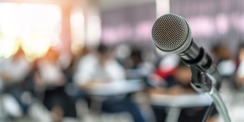 microphone in foreground at meeting