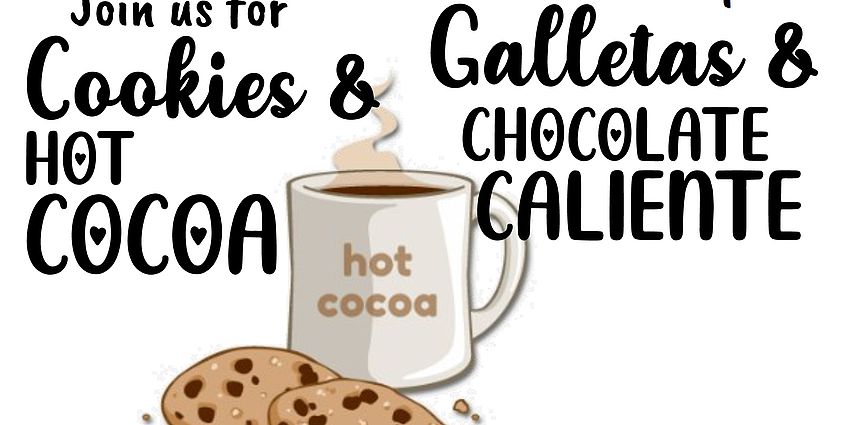 White mug saying hot cocoa and two chocolate chip cookies