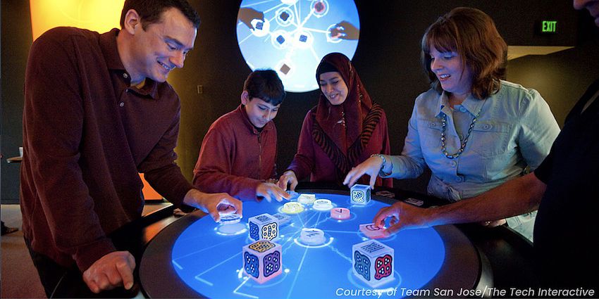 group of family around a table with cubes