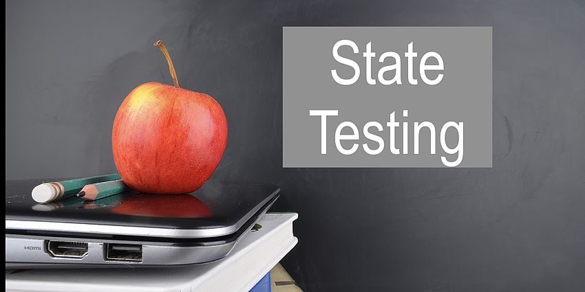 State Testing red apple on a laptop computer