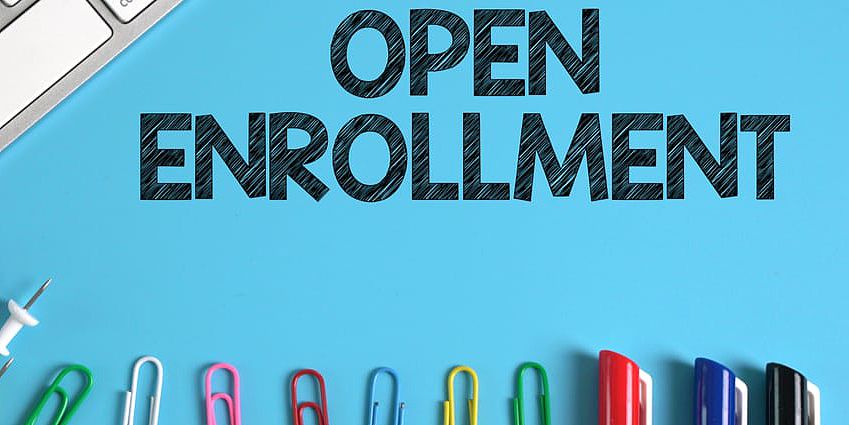 Open Enrollment Image with paperclips and pens