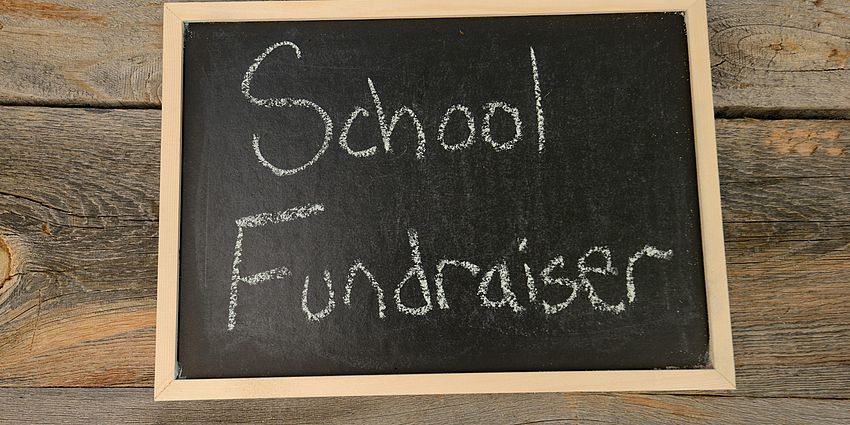 Words School Fundraiser written on a chalkboard