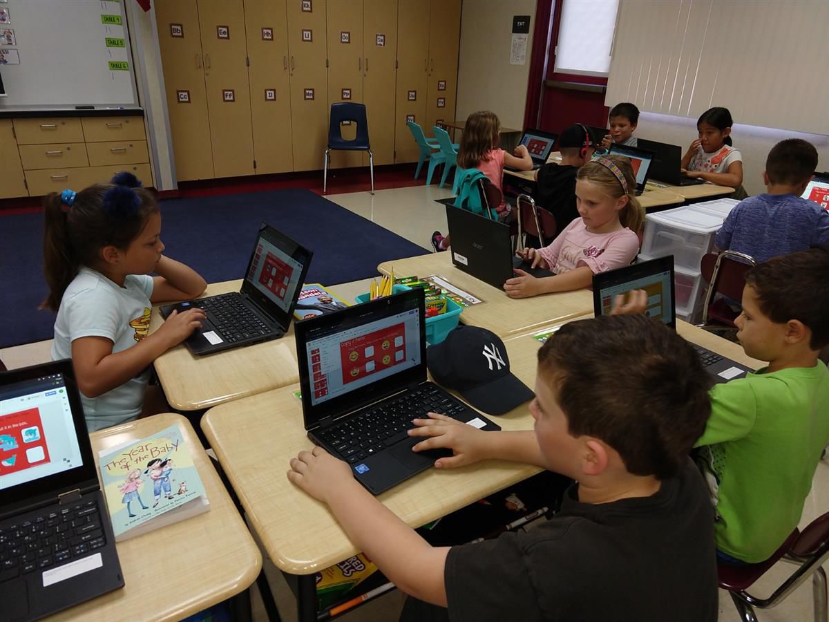 Children using Chromebooks in classroom