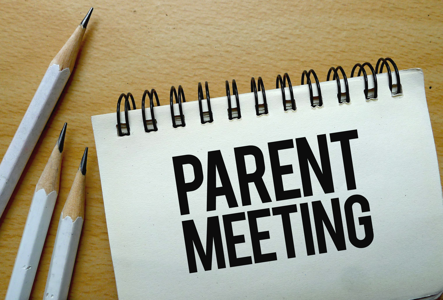 Parent Meeting written on a spiral tablet