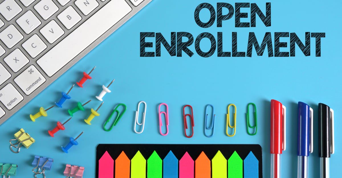 Open Enrollment Image with paperclips and pens