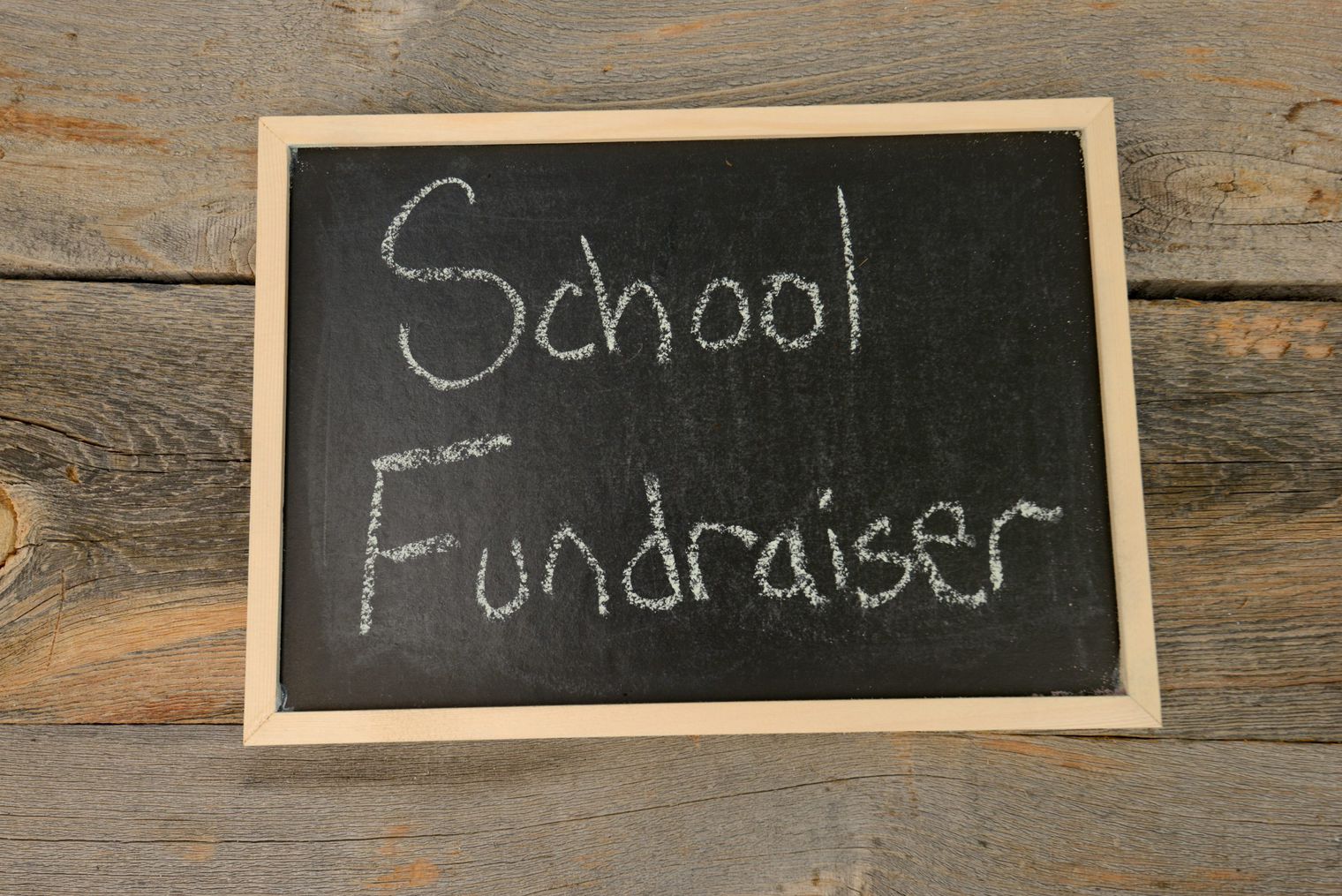 Words School Fundraiser written on a chalkboard