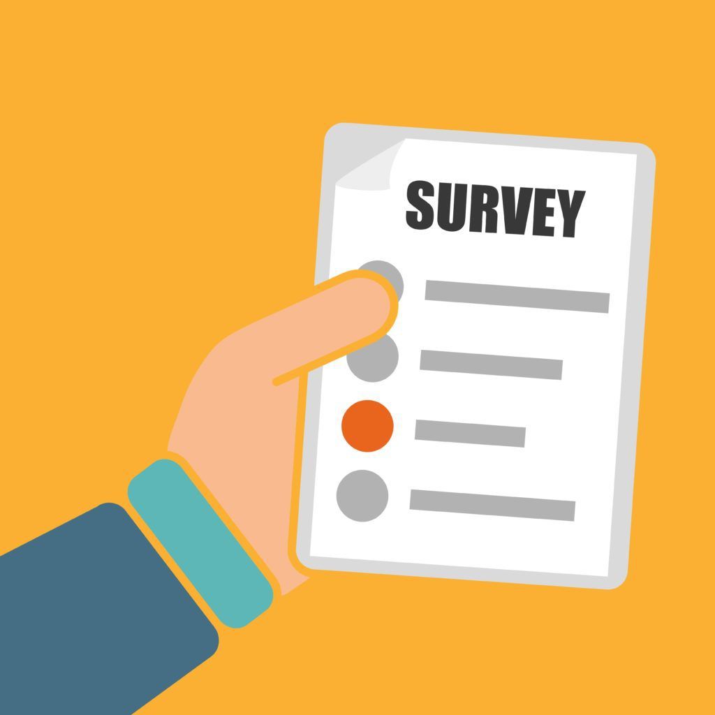 Picture of a person holding a survey