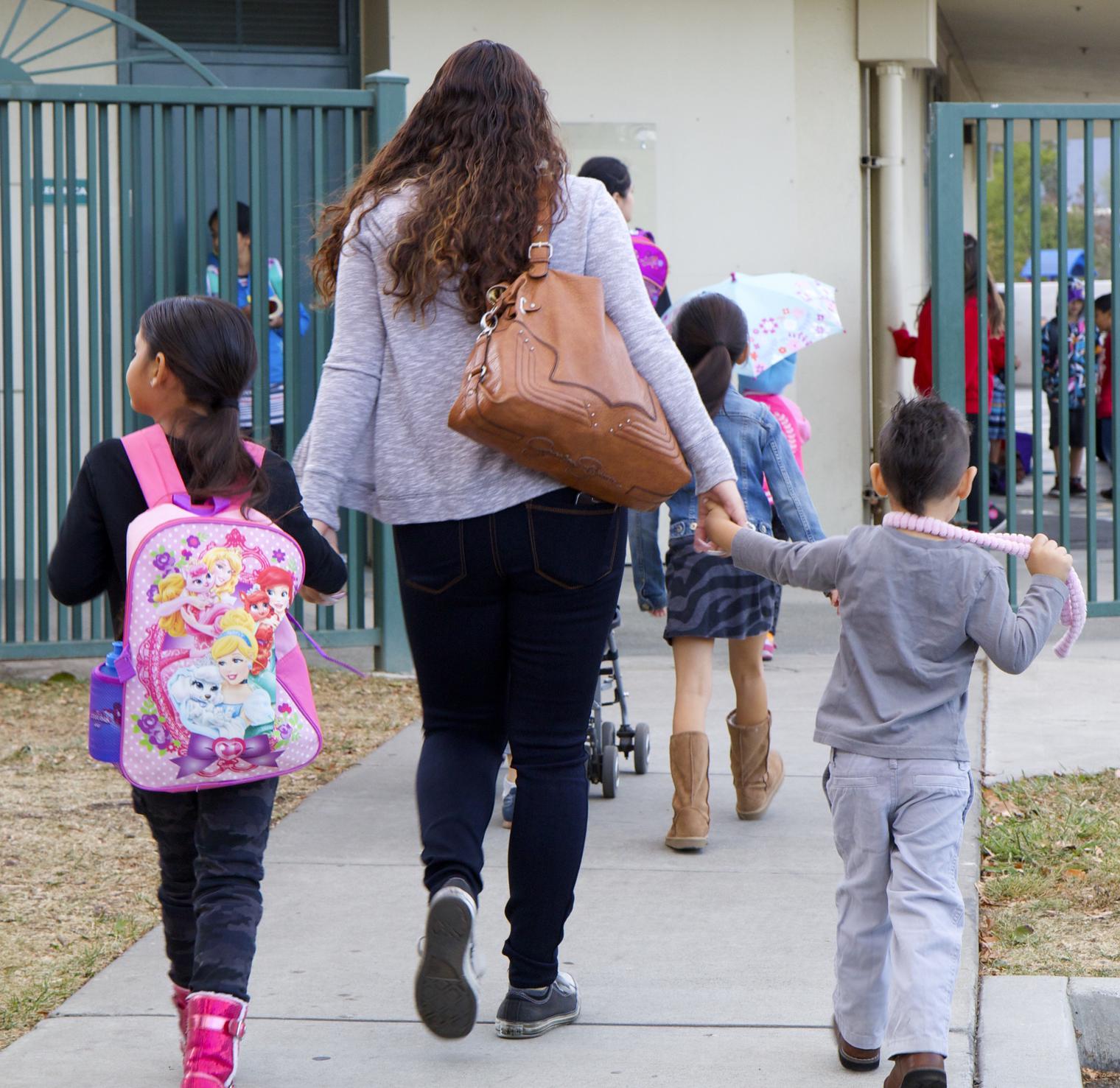 students and parents walk to school